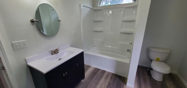 217 Flynn St, Redwood Falls, MN 56283 - full bathroom with wood finished floors, toilet, vanity, and bathing tub / shower combination