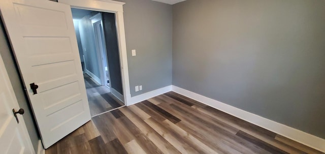 217 Flynn St, Redwood Falls, MN 56283 - empty room with baseboards and dark wood finished floors