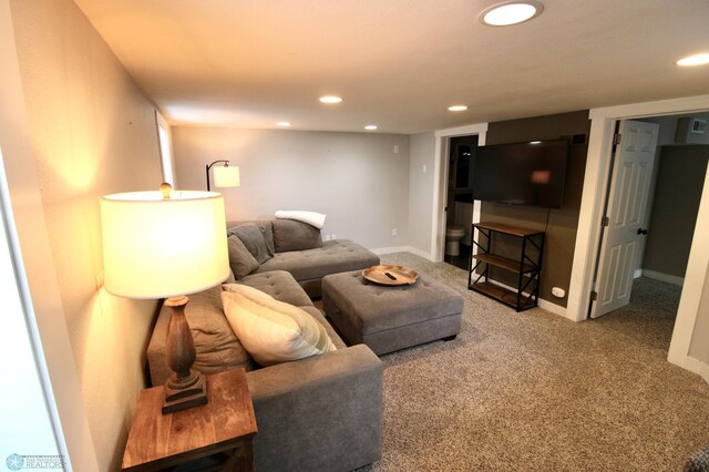 carpeted living room with recessed lighting and baseboards