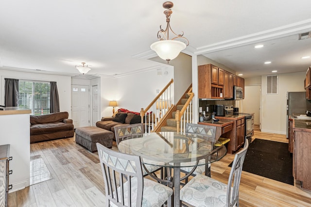 21113 Clydesdale Curv, Forest Lake, MN 55025 - dining area with stairs, light wood finished floors, recessed lighting, and baseboards