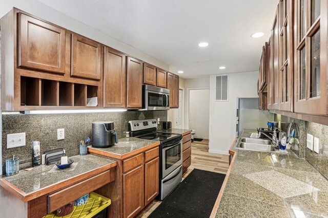 21113 Clydesdale Curv, Forest Lake, MN 55025 - kitchen featuring tile countertops, appliances with stainless steel finishes, recessed lighting, tasteful backsplash, and a sink