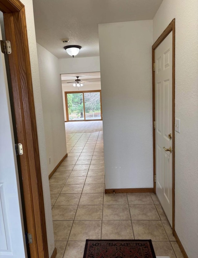 1432 Tall Grass, Hudson, WI 54016 - hallway featuring light tile patterned flooring and baseboards