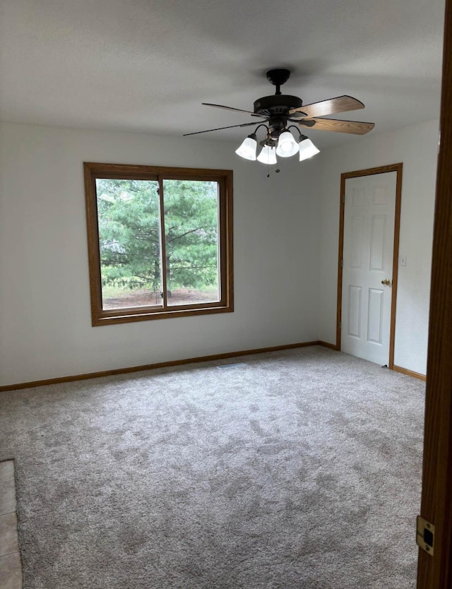 1432 Tall Grass, Hudson, WI 54016 - carpeted spare room with baseboards and ceiling fan