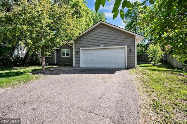 230 8th St NW, Elk River, MN 55330 - ranch-style home featuring driveway and an attached garage