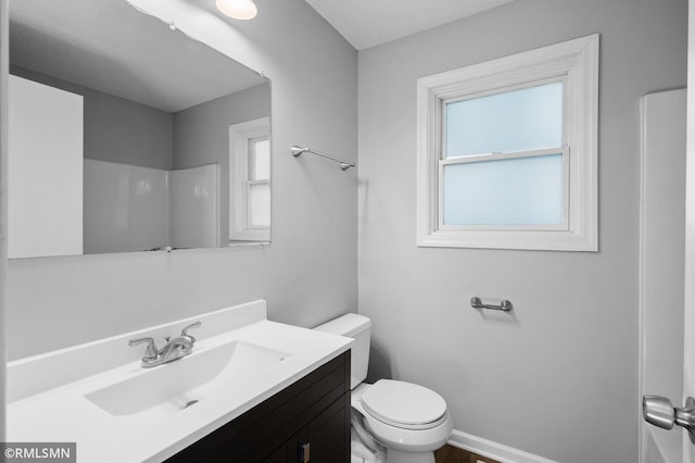 230 8th St NW, Elk River, MN 55330 - full bath featuring toilet and vanity