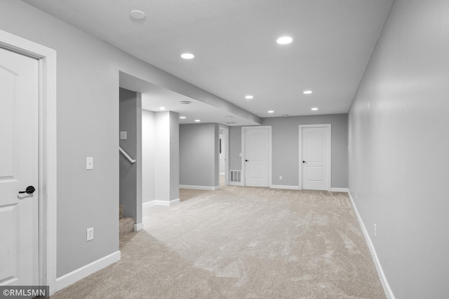 230 8th St NW, Elk River, MN 55330 - finished basement with light carpet, recessed lighting, baseboards, and stairs
