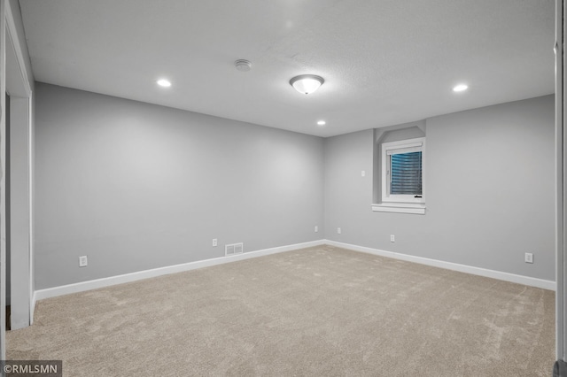 230 8th St NW, Elk River, MN 55330 - spare room with light carpet, recessed lighting, baseboards, and a smoke detector