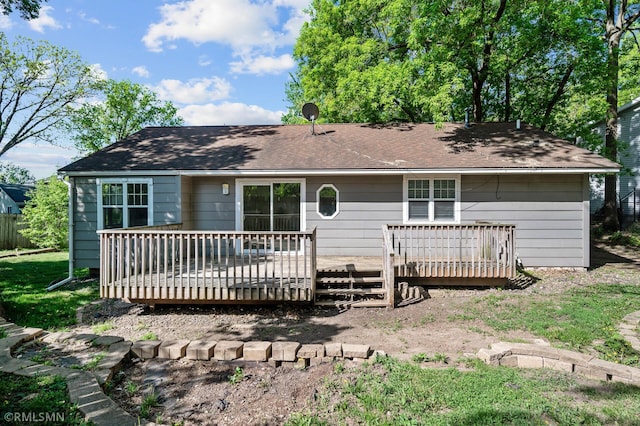 230 8th St NW, Elk River, MN 55330 - ranch-style home with a deck and roof with shingles