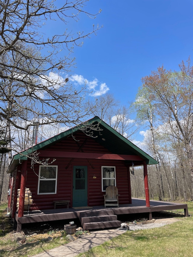 view of front of house with log veneer siding