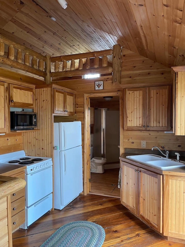 kitchen featuring white appliances, vaulted ceiling, dark wood finished floors, wooden ceiling, and a sink