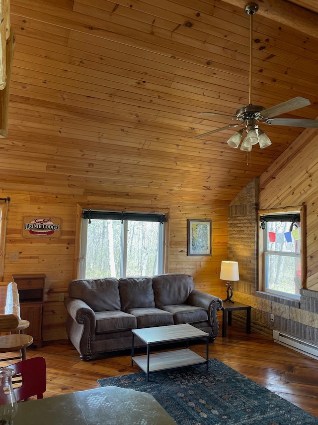 living room with wooden walls, a ceiling fan, lofted ceiling, wood finished floors, and baseboard heating