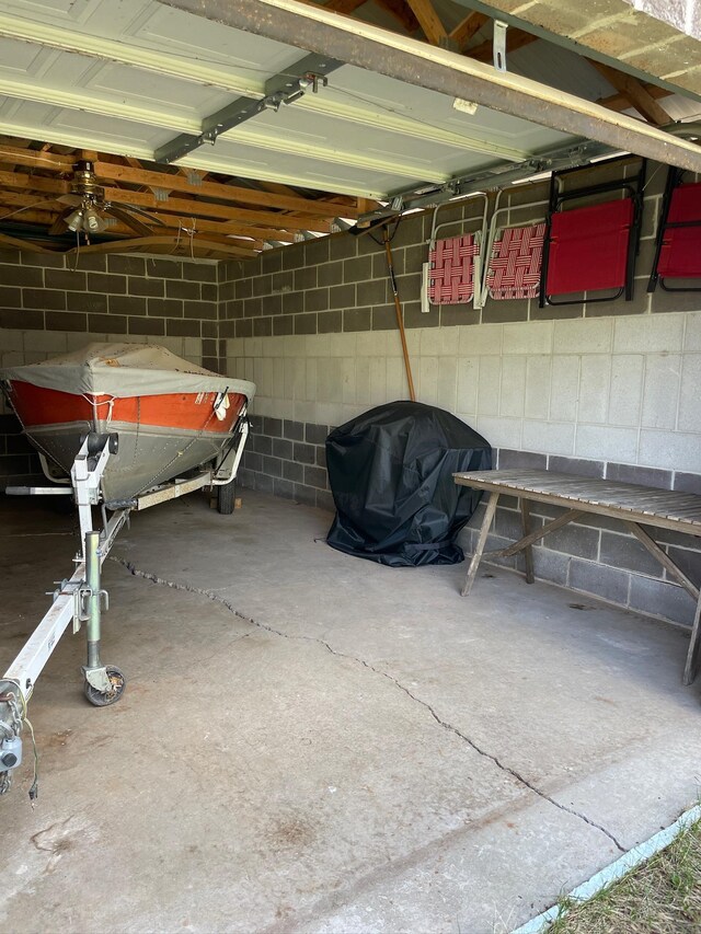 garage with concrete block wall
