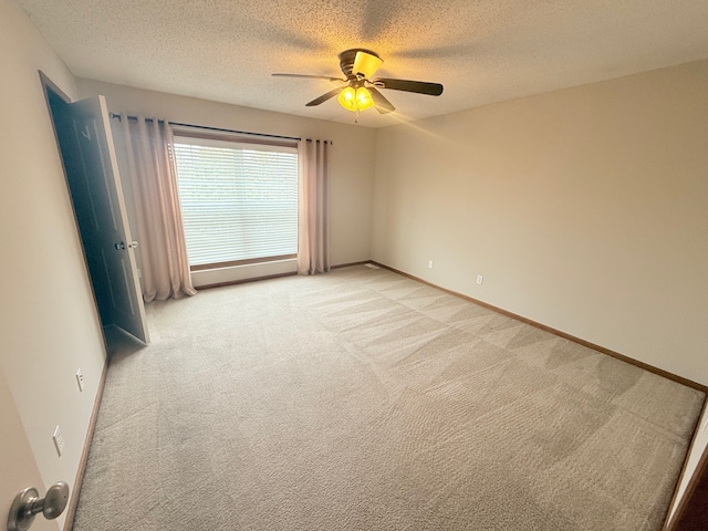 5173 Farnham Dr N, Hugo, MN 55038 - empty room with light colored carpet, ceiling fan, a textured ceiling, and baseboards
