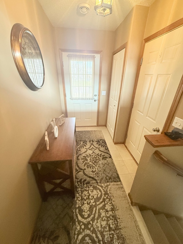 5173 Farnham Dr N, Hugo, MN 55038 - entryway with a textured ceiling and light tile patterned floors