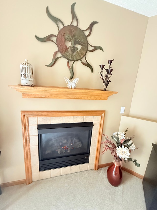 5173 Farnham Dr N, Hugo, MN 55038 - detailed view of carpet floors, a tiled fireplace, and baseboards