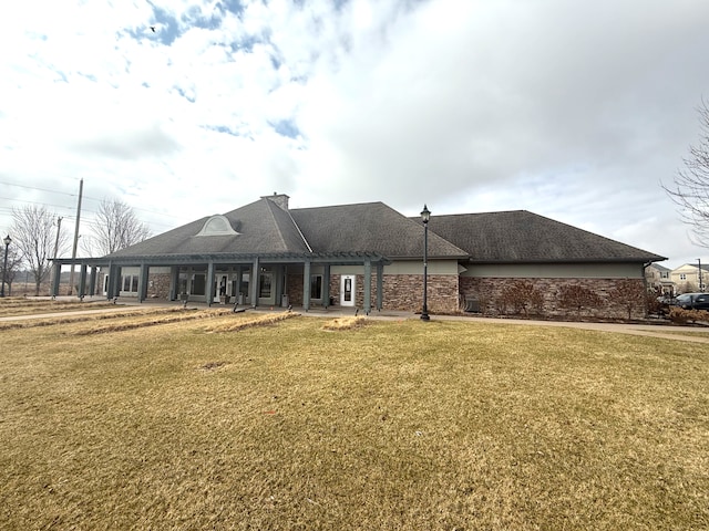 5173 Farnham Dr N, Hugo, MN 55038 - rear view of house featuring a yard, a patio, brick siding, a pergola, and a chimney
