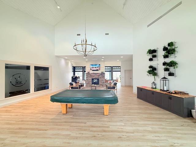 5173 Farnham Dr N, Hugo, MN 55038 - rec room with light wood-style flooring, high vaulted ceiling, a chandelier, billiards, and recessed lighting