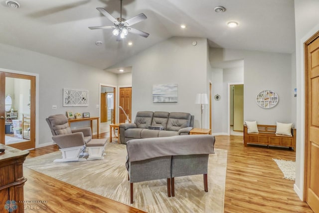 living area with light wood finished floors, ceiling fan, high vaulted ceiling, baseboards, and recessed lighting