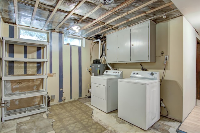 1286 Krattley Ln, North Hudson, WI 54016 - laundry area featuring washer and dryer, gas water heater, and cabinet space