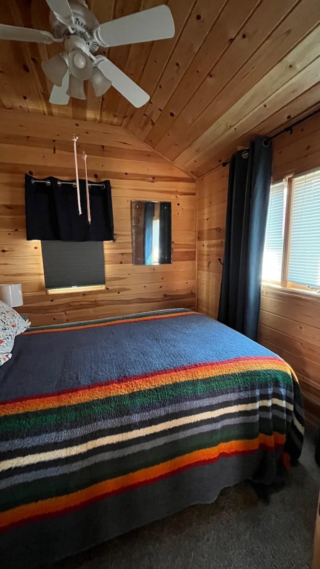 bedroom featuring lofted ceiling, wooden walls, and wood ceiling