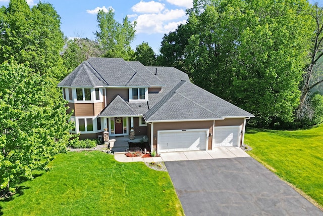11600 43rd Ave N, Plymouth, MN 55442 - view of front of home with driveway, a shingled roof, a front yard, and an attached garage