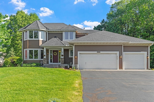 11600 43rd Ave N, Plymouth, MN 55442 - view of front of home with driveway, an attached garage, a front yard, and a shingled roof