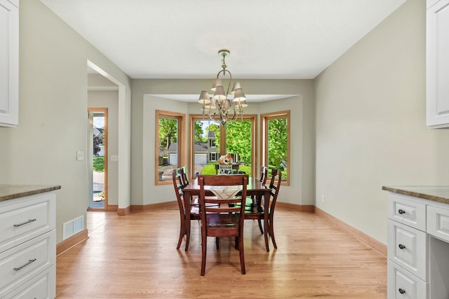 11600 43rd Ave N, Plymouth, MN 55442 - dining space featuring a chandelier, light wood-style floors, and baseboards