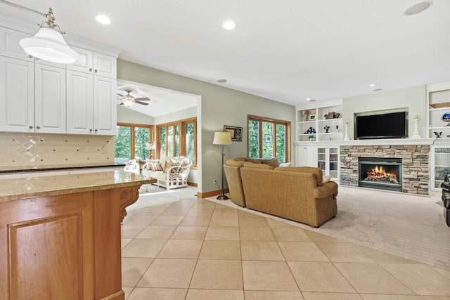 11600 43rd Ave N, Plymouth, MN 55442 - living room featuring a fireplace, light tile patterned floors, a ceiling fan, recessed lighting, and baseboards