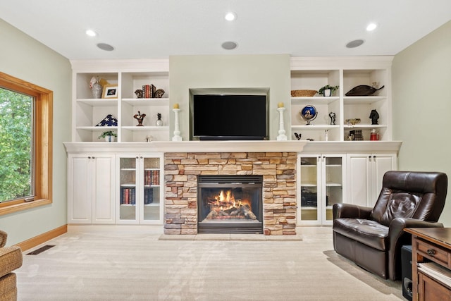 11600 43rd Ave N, Plymouth, MN 55442 - carpeted living room featuring a stone fireplace, baseboards, and built in shelves