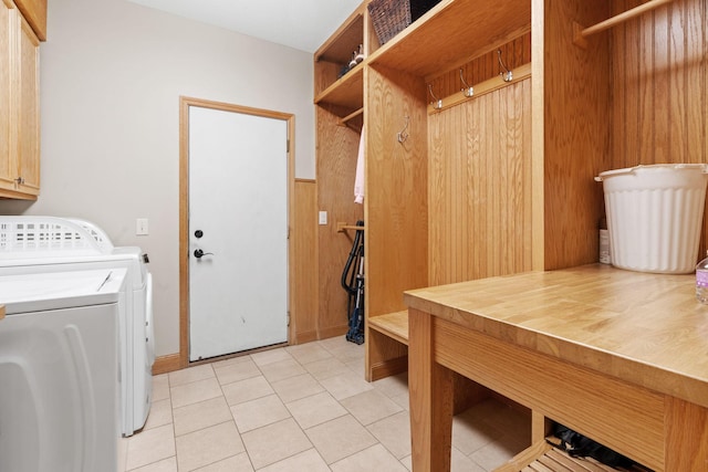 11600 43rd Ave N, Plymouth, MN 55442 - laundry area with washing machine and clothes dryer, light tile patterned floors, and wooden walls