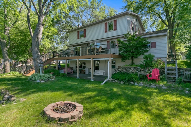 12177 Fremont Ln, Zimmerman, MN 55398 - back of house with stairs, an outdoor fire pit, a wooden deck, and a patio