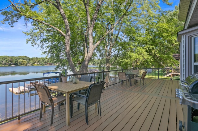 12177 Fremont Ln, Zimmerman, MN 55398 - deck with outdoor dining space and a water view