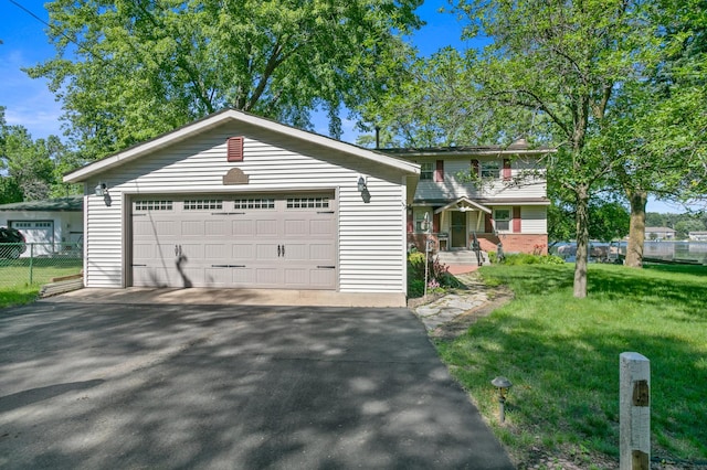 12177 Fremont Ln, Zimmerman, MN 55398 - view of front facade with a garage and an outbuilding