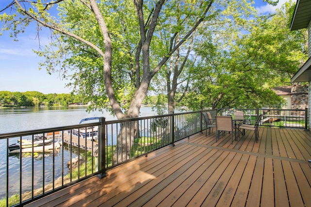 12177 Fremont Ln, Zimmerman, MN 55398 - wooden deck featuring a water view and outdoor dining space