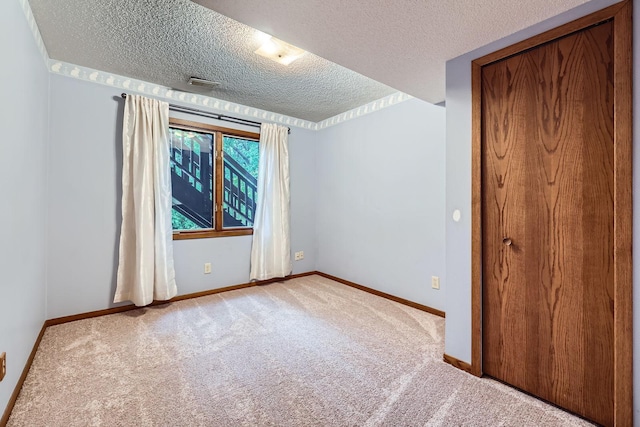 11476 65th Pl N, Maple Grove, MN 55369 - unfurnished room featuring carpet, a textured ceiling, and baseboards