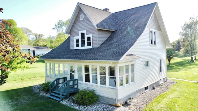 308 Cedar Ave S, Odessa, MN 56276 - back of house featuring a shingled roof, a yard, and a chimney