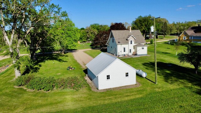 308 Cedar Ave S, Odessa, MN 56276 - view of subject property with a tree filled landscape