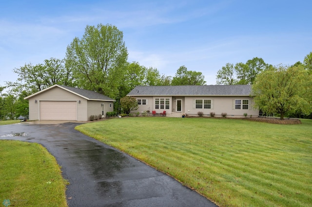 15350 Blackhawk Rd, Audubon, MN 56511 - ranch-style house featuring an outbuilding, a garage, a front lawn, and entry steps
