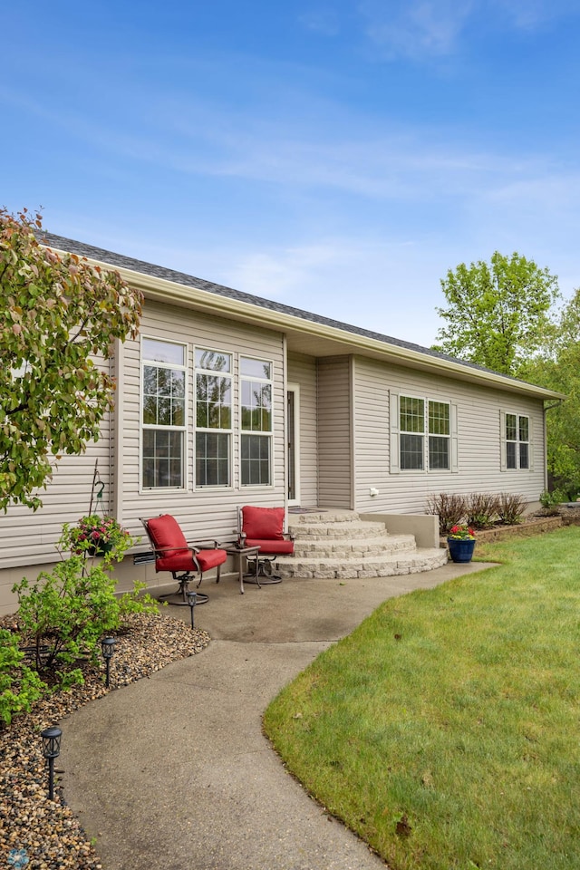 15350 Blackhawk Rd, Audubon, MN 56511 - view of front facade featuring a front yard and a patio