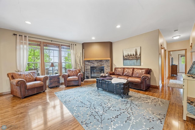 15350 Blackhawk Rd, Audubon, MN 56511 - living room with a fireplace, plenty of natural light, wood finished floors, and recessed lighting