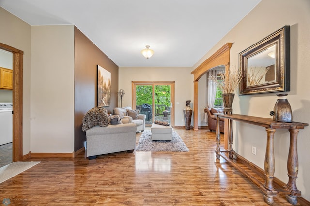 15350 Blackhawk Rd, Audubon, MN 56511 - living room with light wood finished floors, baseboards, and washer / clothes dryer