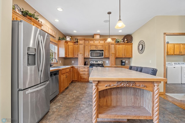 15350 Blackhawk Rd, Audubon, MN 56511 - kitchen with washing machine and clothes dryer, stainless steel appliances, stone finish flooring, a sink, and light countertops