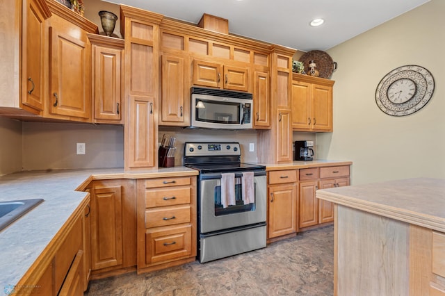 15350 Blackhawk Rd, Audubon, MN 56511 - kitchen featuring stainless steel appliances, light countertops, recessed lighting, and stone finish flooring