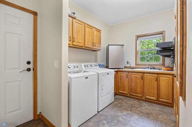 15350 Blackhawk Rd, Audubon, MN 56511 - laundry room with cabinet space, washer and clothes dryer, and stone finish floors