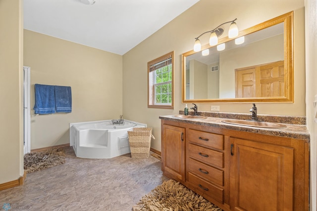 15350 Blackhawk Rd, Audubon, MN 56511 - bathroom with baseboards, a garden tub, and double vanity