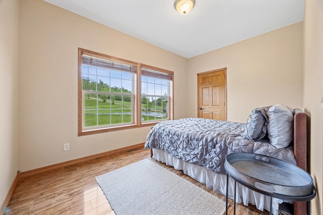 15350 Blackhawk Rd, Audubon, MN 56511 - bedroom featuring baseboards and wood finished floors