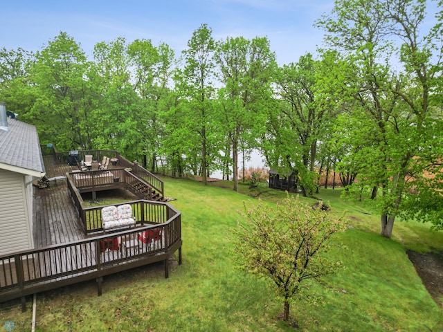 15350 Blackhawk Rd, Audubon, MN 56511 - view of green lawn with a wooden deck and view of wooded area
