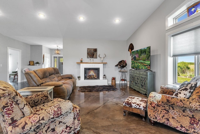13936 County Road 7 NW, Clearwater Twp, MN 55320 - living area with healthy amount of natural light, finished concrete flooring, a glass covered fireplace, and recessed lighting