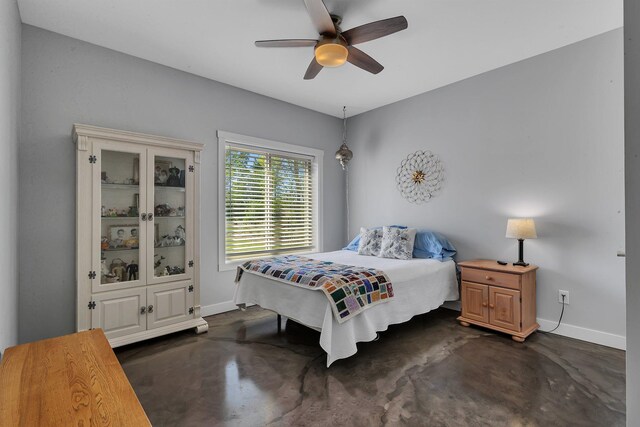 13936 County Road 7 NW, Clearwater Twp, MN 55320 - bedroom with baseboards, finished concrete flooring, and a ceiling fan