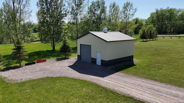 13936 County Road 7 NW, Clearwater Twp, MN 55320 - view of outdoor structure featuring an outbuilding, view of scattered trees, and driveway